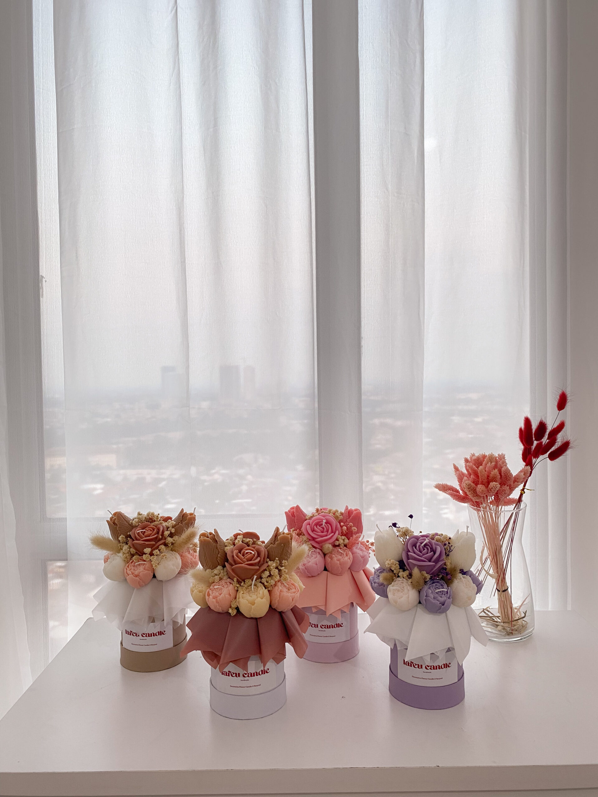 Collection of four mini flower candle box designs in beige-brown, brown-white, pink, dan purple